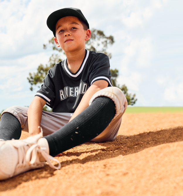 Kid wearing a baseball uniform