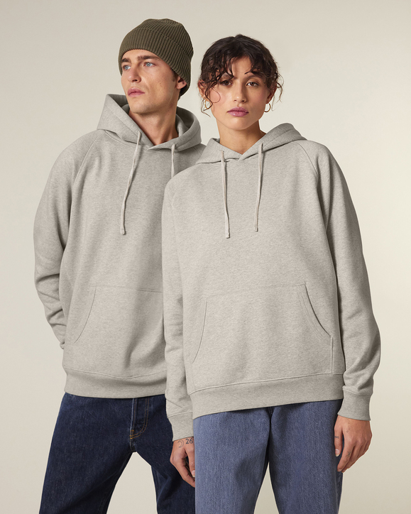 A man and woman wearing hoodies